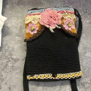 Handcrafted Black Crochet Crossbody Bag with Pink Flower Accent